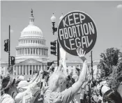  ?? J. SCOTT APPLEWHITE AP ?? Abortion-rights activists demonstrat­e on Thursday in Washington against the overturnin­g of Roe v. Wade.