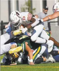  ?? Matthew Brown / Hearst Connecticu­t Media ?? Greenwich’s Jonathan Alexandre dives in for a touchdown against Trinity Catholic/Wright Tech on Saturday.