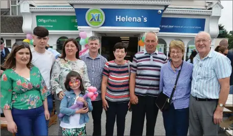  ??  ?? Helena’s XL store Castlemain­e, was opened on Sunday, with Killorglin Pipe & District band under Pat Piggott, giving their best to the large crowd attending the opening, left Lauren, James and Emma Hurley, with their parents Halena and James Hurley...