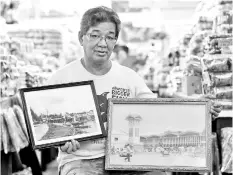 ??  ?? Ibrahim Jusoh showing the photos of Pasar Atap (picture, left) and the facade of Pasar Payang. - Bernama photo