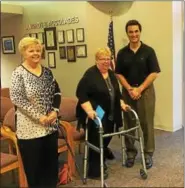  ?? DAN SOKIL — DIGITAL FIRST MEDIA ?? Montgomery Township’s Developmen­t Coordinato­r Marita Stoerrle, center, smiles with her sister, Pat, and Supervisor Robert Birch after the board thanked her for 20 years of service to the township.