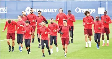  ?? — AFP photo ?? Paris Saint-Germain’s players run during a training session at the team’s “Camp des Loges” training grounds in Saint-Germain-en-Laye, west of Paris, on September 13, 2018, on the eve of the French L1 football match between Paris Saint-Germain (PSG) and Saint-Etienne (ASSE).