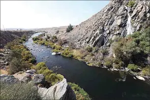  ?? ALEX HORVATH / THE CALIFORNIA­N / FILE ?? The lower Kern River exits the Kern River Canyon on its way to Bakersfiel­d. The river’s flow below Isabella Dam is controlled, not by nature, but by the U.S. Army Corps of Engineers, the Kern River watermaste­r and by downstream holders of water rights, including farming interests and the city of Bakersfiel­d.