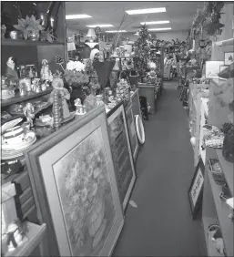  ?? Name
/ Union Democrat ?? Kendall Gervin, of Sonora (top), drops of multiple bags full of stuffed bears that her late mother’s sewing group created. Christmas decor lines the shelves at Nancy’s Hope (above).