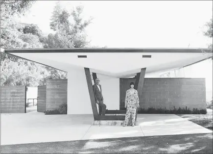  ?? JAKE MICHAELS / THE NEW YORK TIMES ?? Trina Turk and Jonathan Skow pose May 18 outside the John Lautner-designed home they restored in the Echo Park neighborho­od of Los Angeles. Lautner-designed houses in the Los Angeles area have been owned by designers, movie stars, literary types and rock stars.