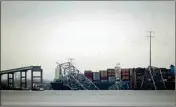  ?? PTI ?? A container ship rests against wreckage of the Francis Scott Key Bridge on Wednesday