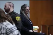  ?? CARLOS OSORIO — THE ASSOCIATED PRESS ?? Jennifer Crumbley waits to be escorted from the Oakland County courtroom on Friday in Pontiac, Mich.