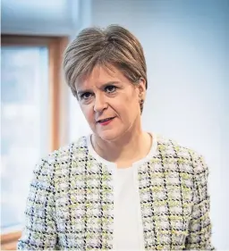  ?? Pictures: PA/Dougie Nicolson. ?? Above: First Minister Nicola Sturgeon in Edinburgh. Top: A tent is being used at the side of Ardblair Medical Practice in Blairgowri­e as steps are being taken to combat the virus.