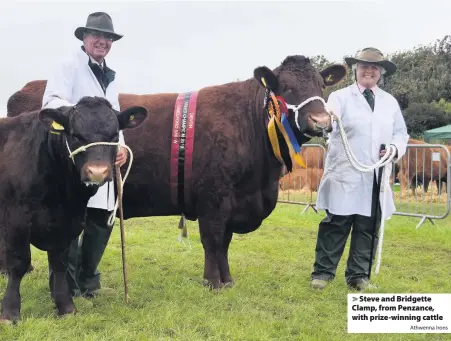  ?? Athwenna Irons ?? > Steve and Bridgette Clamp, from Penzance, with prize-winning cattle