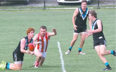  ??  ?? Yarragon’s Jarryd Kilday and Trafalgar’s Darcy Brock batlle for the ball.