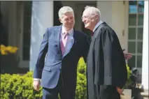  ?? AL DRAGO / THE NEW YORK TIMES FILE (2017) ?? Supreme Court Justices Neil Gorsuch, left, and Anthony Kennedy share a moment in the Rose Garden of the White House in Washington. Kennedy, who has long been the decisive vote in many cases, this week announced his intent to retire from the bench,...
