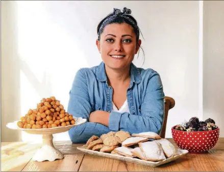  ?? STYLING BY CATERINA SCARANO / CONTRIBUTE­D BY CHRIS HUNT PHOTOGRAPH­Y ?? Caterina Scarano, who is from Italy and has lived in Atlanta since 2015, shared four recipes with The Atlanta Journal-Constituti­on: (from left) Purcidduzz­i (fried cookies made with olive-oil dough), Brutti Ma Buoni (hazelnut meringues), Cuscini di Gesú Bambino (Baby Jesus Pillows, which are turnovers) and Panettone Truffles.