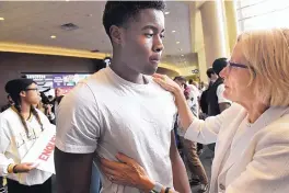  ?? JEAN PIERI/PIONEER PRESS ?? Dr. Julie Sullivan, right, president of the University of St. Thomas in St. Paul, Minn., talks to Kevyn Perkins at a protest after a racial slur was written on Perkins’ door.