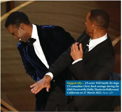  ?? Photo: AFP ?? Slapped silly… US actor Will Smith (R) slaps US comedian Chris Rock onstage during the 94th Oscars at the Dolby Theatre in Hollywood, California on 27 March 2022.