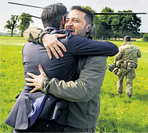  ?? ?? Volodymyr Zelensky, the president of Ukraine, hugs Rishi Sunak, the Prime Minister, at Chequers, where he was promised a delivery of custom-built suicide drones