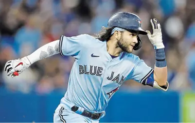  ?? VAUGHN RIDLEY GETTY IMAGES ?? Bo Bichette of the Blue Jays runs the bases after hitting a two-run home run in the sixth inning against the Astros on Sunday.