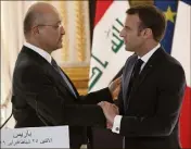  ?? (Photo EPA) ?? Barham Saleh et Emmanuel Macron, hier, au Palais de l’Elysée.