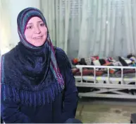  ?? Sam McNeil / AP Photo ?? The US ban adds to the worries of Syrian refugee Mayada Sheik, 37. She is currently in Jordan and the sole caretaker of her husband Nasser, bedridden after a stroke, and breadwinne­r for herself, Nasser and four children.