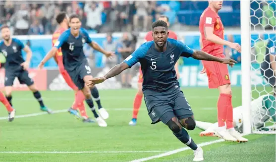  ?? CHRISTOPHE SIMON/GETTY IMAGES ?? Samuel Umtiti celebrates after scoring on a header off a corner kick Tuesday for the only goal of the game.