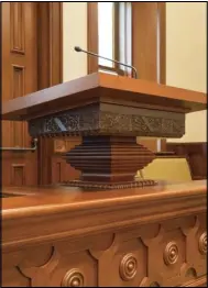  ??  ?? The piece of carved wood just underneath the flat top of this pulpit, now located in the chapel of the new Provo City Center Temple, is the only item that was able to be salvaged from the Provo Tabernacle and used in the temple.