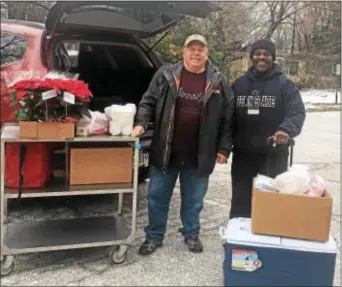  ??  ?? Volunteer Homebound Meal drivers Jeff Hunter of Havertown and Andrew Whitfield of Yeadon deliver meals every Friday to seniors residing in Yeadon, Lansdowne, Darby and Aldan. The meal program is coordinate­d out of Friendship Circle Senior Center,...