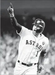  ?? Wally Skalij Los Angeles Times ?? CARLOS CORREA celebrates his two-run homer in the seventh inning in Game 5 of the World Series.