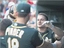  ?? RONALD MARTINEZ — GETTY IMAGES ?? Matt Chapman, celebratin­g a second-inning home run on Thursday, added two triples to lead the A’s over the Rangers.