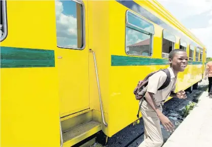  ?? FILE ?? In this 2011 photo, Davian Stewart, then a grade seven student of Jonathan Grant High School, walks away after taking a peek into a train coach in Spanish Town, St Catherine.