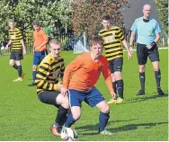  ??  ?? Fairmuir (orange) came out on top in a goal-fest against Pitfour, winning 9-3.