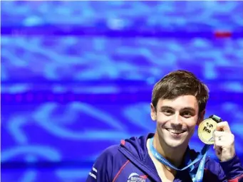  ?? (Getty) ?? Tom Daley with his gold medal in Budapest