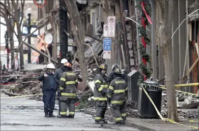  ??  ?? Officials are continuing to assess building damage caused by the Christmas Day explosion in
Nashville. The blast led to phone and data service outages and disruption­s over hundreds of miles in the southern
U.S.
AP photo