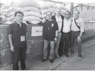 ??  ?? Photo shows Hubert d'Aboville (center), president and executive director of Together-Ensemble; Fr. Eduardo Vasquez (on his left), OMI head of Galilee Farm, Antipas; NFA Regional Director Marcelino Alvarez (2nd from right); Ruben Torres (right),...