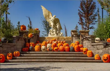  ?? By Ed HelmickIn ?? October, the steps leading to the Archangel Michael statue are lined with Jack-o-Lanterns.