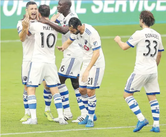  ?? STEPHEN M. DOWELL/ORLANDO SENTINEL/VIA THE ASSOCIATED PRESS ?? The Impact’s Blerim Dzemaili, left, celebrates with teammates after Dzemaili scored in Orlando on Saturday.