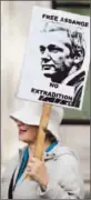  ?? Oli Scarff Getty Images ?? A SUPPORTER of Julian Assange pickets outside the British Supreme Court in London.