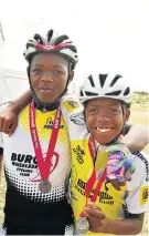  ?? Picture: EUGENE COETZEE ?? YOUNG CHAMPS: Bongani Jakavula, 16, left, and Lutho Mabamga, 11, received their medals after completing the 55km race at The Herald Continenta­l Cycle Tour on Sunday