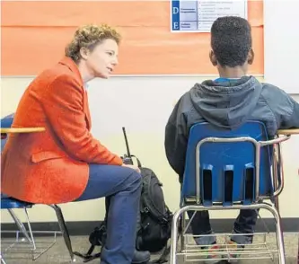  ?? PHOTOS BY MIKE SIEGEL/SEATTLE TIMES ?? In the “Focus Room” at Mill Creek Middle School in Kent, Wash., assistant principal Regina Hauptmann, left, works with a student who is serving an in-school suspension.