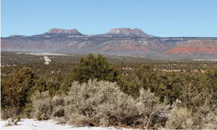  ?? (Annie Knox/Reuters) ?? BEARS EARS, the twin rock formations, dominate the horizon in Utah’s Four Corners region.