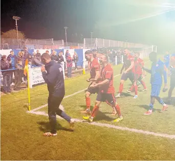  ?? ?? Larkhall Athletic players celebrate at Oak Tree Road following their FA Trophy win