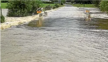  ??  ?? Flooding has closed roads around many parts of Golden Bay – with the roads between Collingwoo­d, Bainham and Puponga closed to traffic yesterday.