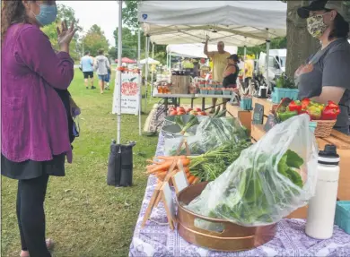  ?? CARLY STONE — MEDIANEWS GROUP ?? Fresh local veggies were available on Saturdays at the Cazenovia Farmers’ Market