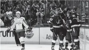  ?? MIKE CARLSON/AP ?? The Lightning's Brayden Point (21) celebrates his goal with Ryan McDonagh (27) and Erik Cernak (81) on Monday in Tampa, Fla. The Lightning won 3-2.