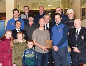  ??  ?? Daniel O’Shea (front second from right) presenting the Liebherr Men’s Competitio­n firs prize to winner Ted Healy with (front) James Curran Incoming Captain, Amy, Laura and Cillian Healy, Derry McCarthy Captain (second row) Eoin O’Donoghue Cat 2, Barry Linehan 3rd, Jack Buckley President, John O’Callaghan 2nd (back from left) Damien Hickey Cat 1, James Arthur Cat 3 and Seamus Doheny Cat 4 at Killarney Golf and Fishing Club recently Photo by Michelle Cooper Galvin