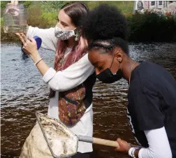  ?? UNIVERSITY OF GUELPH ?? Students Britney Zacharuk, left, and Sandreka Rowe during a field trip class about the life of water. The University of Guelph’s Indigenous Environmen­tal Science and Practice program elevates Indigenous knowledge, creating a more holistic way of learning, says Sheri Longboat, an associate professor at the university.