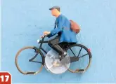  ??  ?? The Magnorail system is also suited to everyday street scenes, with various pre-painted cyclists available. The figures’ legs are fixed to discs of clear plastic and they perform a realistic pedalling action while the cycle is in motion.