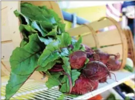  ?? MICHILEA PATTERSON — DIGITAL FIRST MEDIA ?? Fresh, farm-grown radishes are displayed on a mobile food truck in Phoenixvil­le on Wednesday.