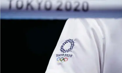  ??  ?? The Tokyo 2020 logo is seen on a staff member’s T-shirt. Photograph: Frank Franklin Ii/AFP/Getty Images