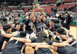  ?? [ERIC ALBRECHT/DISPATCH] ?? Antoinette Williams of Africentri­c celebrates with teammates after they won the Division III state basketball title Saturday in Value City Arena.