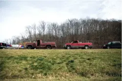  ?? RESHMA KIRPALANI/THE WASHINGTON POST ?? Drivers wait for free food in Hazel Green, Ky. With Kentucky serving as a warning beacon, social services agencies and charities across the country are now preparing for a summer of misery as food prices continue to soar.