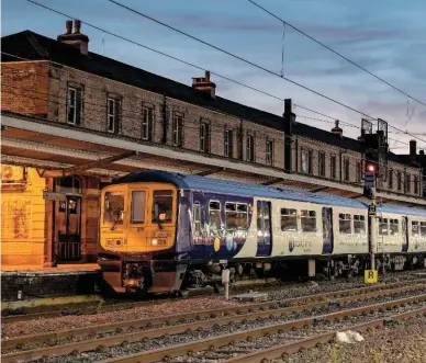  ?? JOHN HALES. ?? A pair of Class 319s stand at Preston on May 24. Network Rail’s failure to electrify the railway via Bolton in time is one of the key reasons for the failure of the new May timetable in the North.